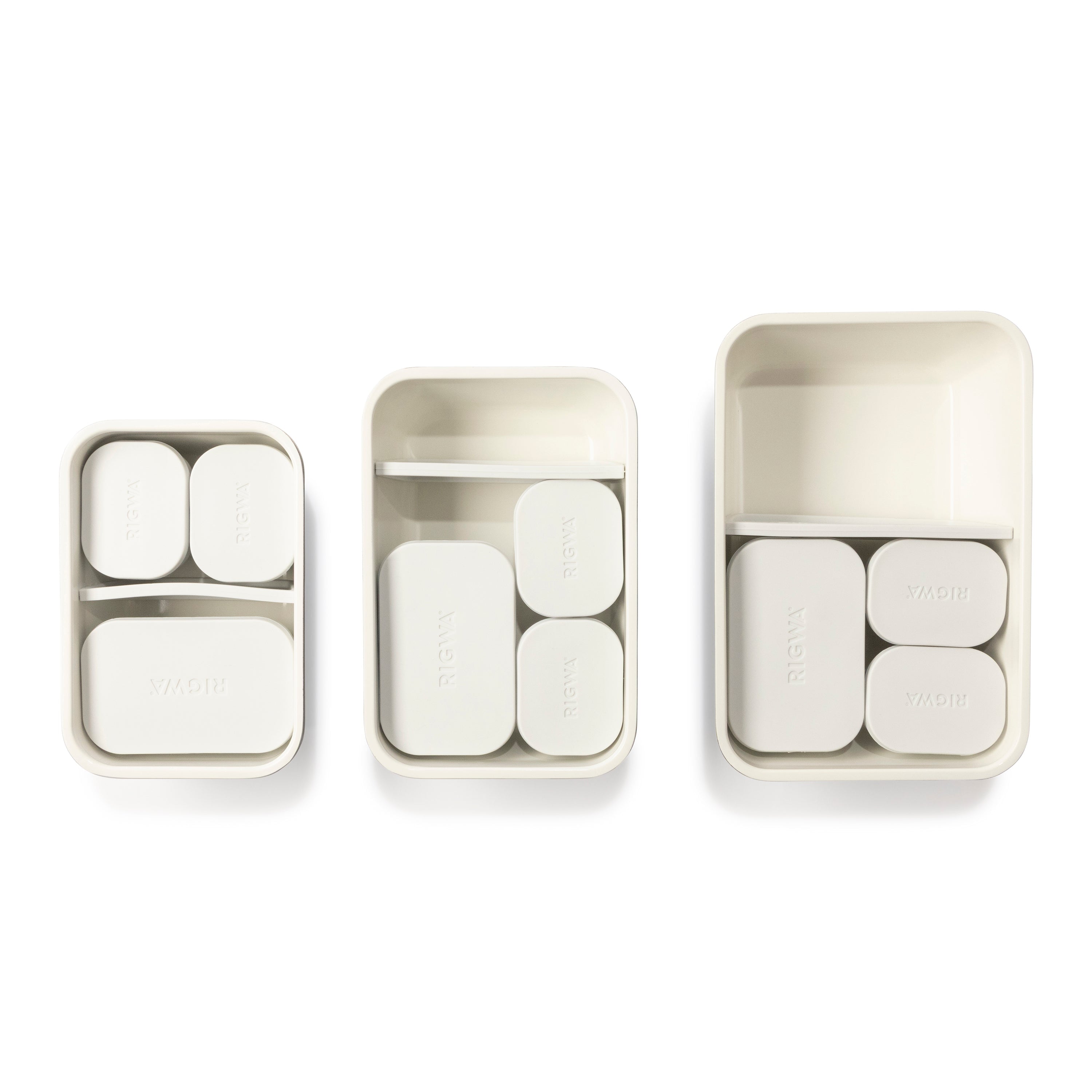 Set of three rectangular containers with compartments on a white background